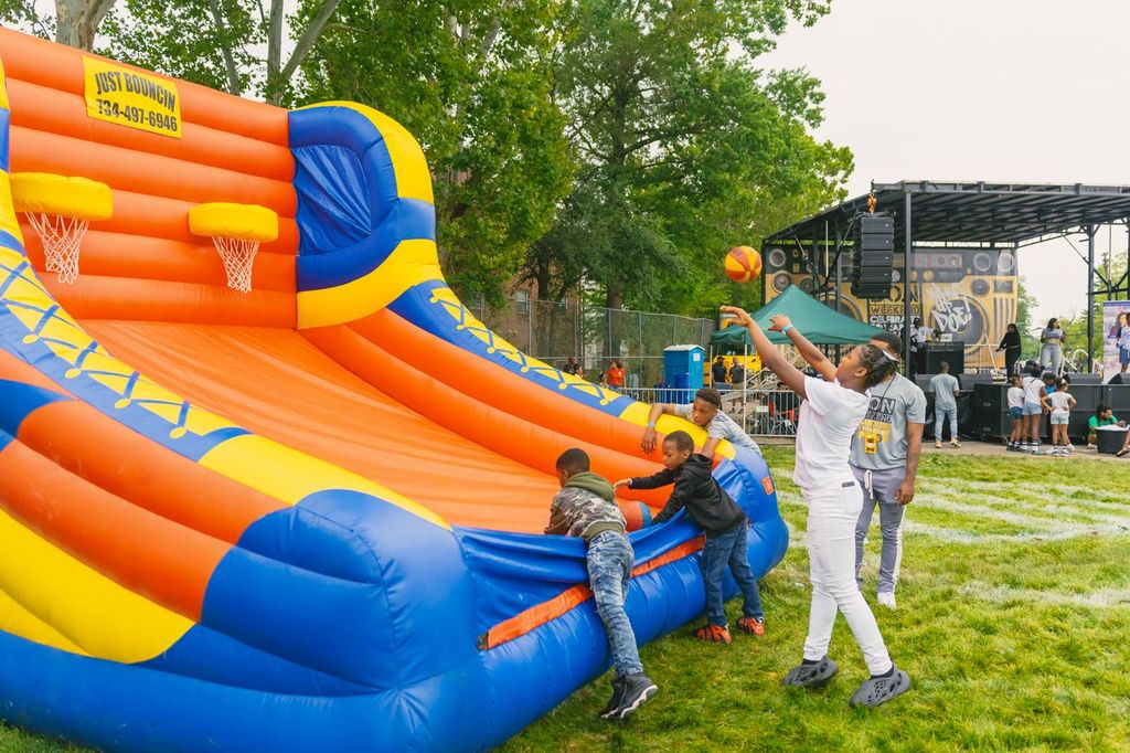 Youth playing at carnival inflatable
