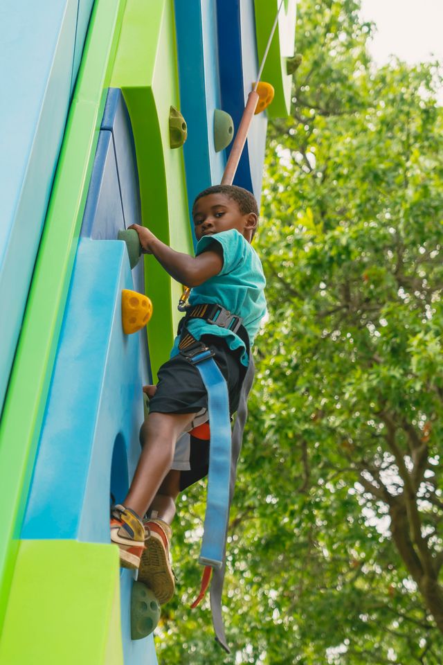 Child climbing a wall