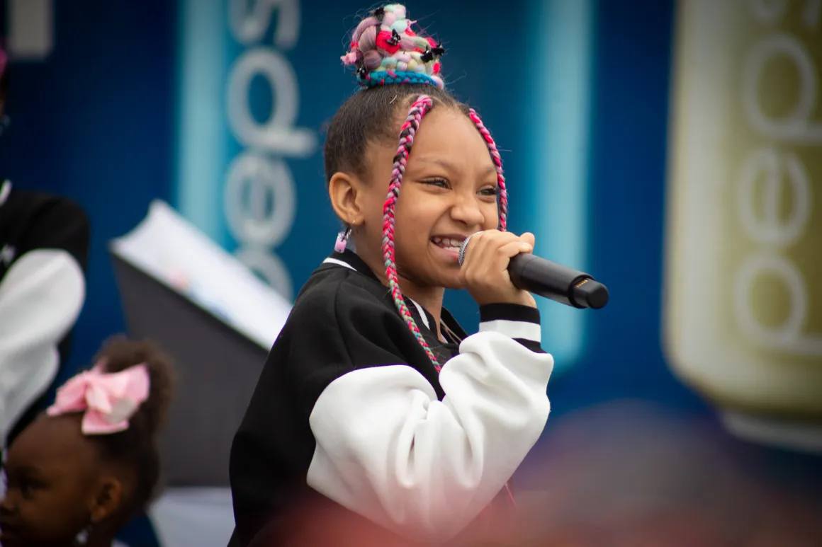 Youth singing on stage